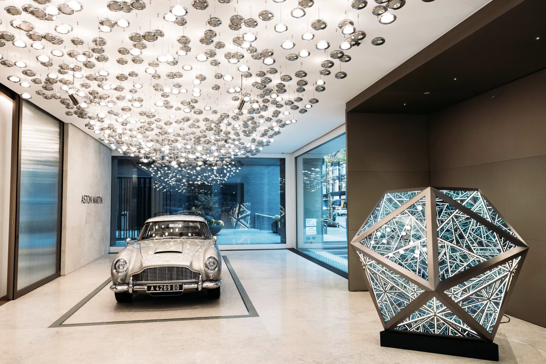 The Q New York lobby, with the DB5 on display